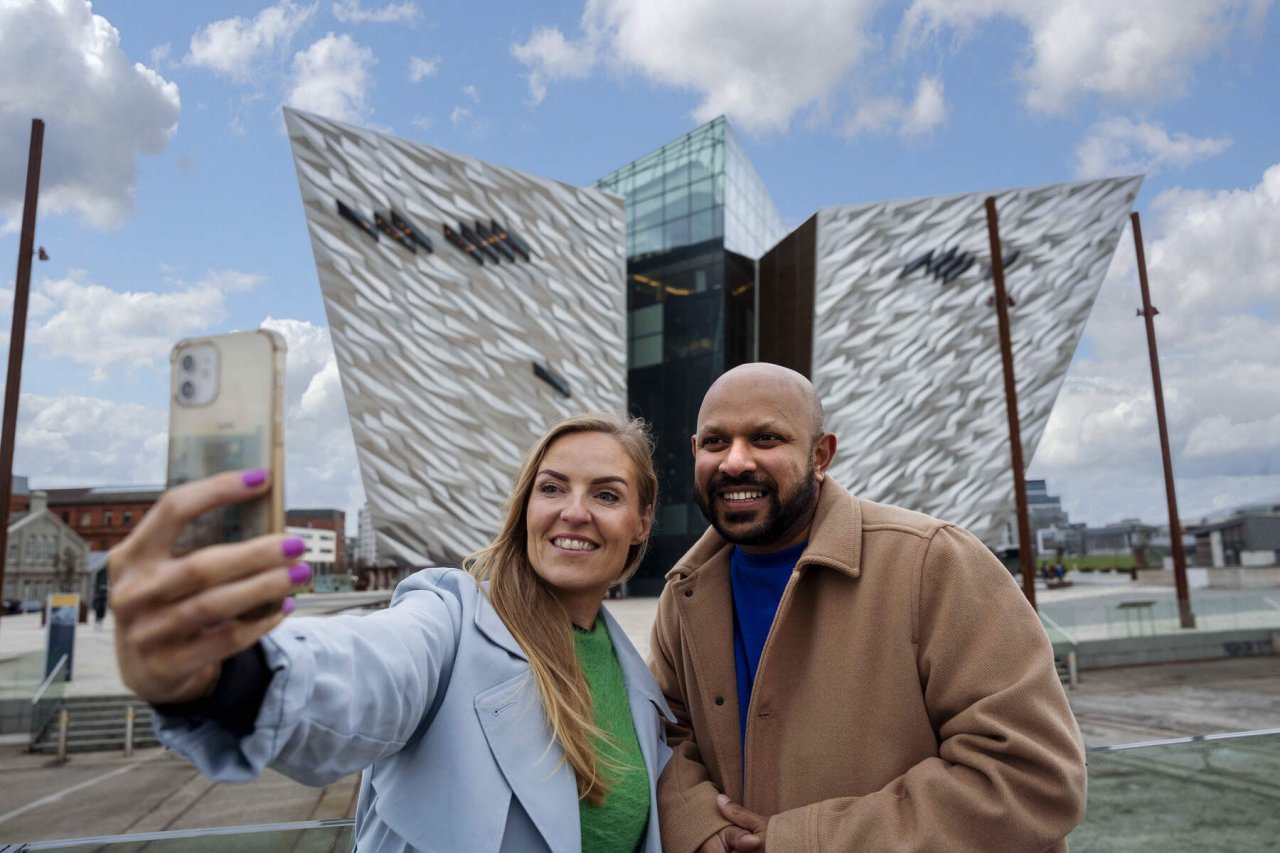 man and woman taking selfie 