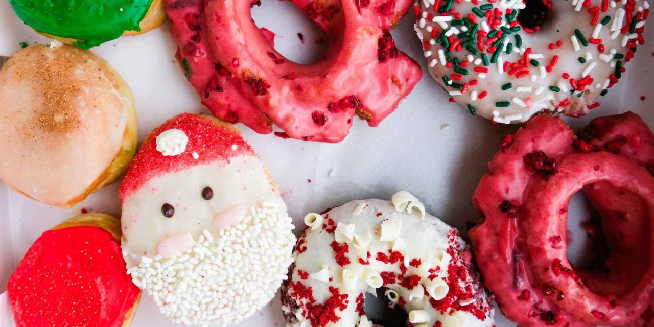 Christmas donuts with sprinkles, red icing and Santa Clause's face