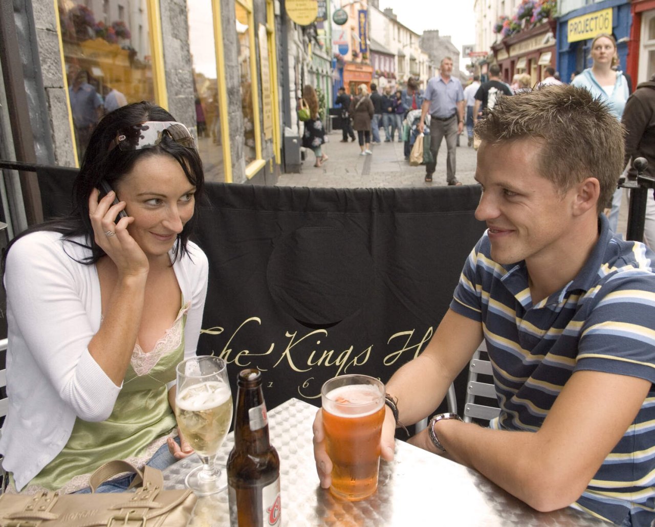 couple sitting outside a bar